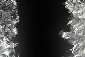 Abstract background. The flour is scattered on a black background. Copy space. photo