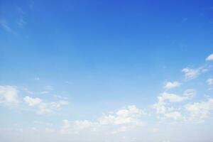 Blue sky background and white clouds soft focus, and copy space horizontal shape. photo