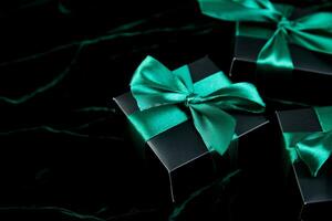 Luxury black gift boxes with green ribbon photo