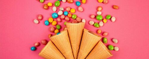 Banner Ice cream waffles cones with colorful candy photo