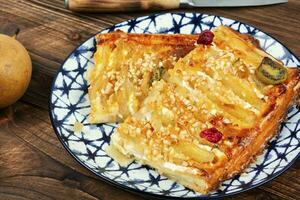 Plate with pear cake, delicious dessert. photo