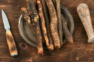 Raw salsify in herbal medicine, salsify roots. photo