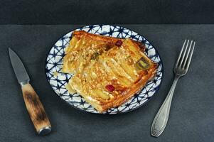 Autumn fruit pie with pear photo