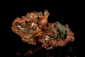 Macro stone metal metal copper in rock on black background photo