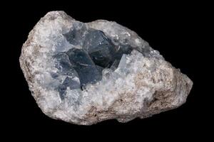 Celestine mineral stone macro on microcline on black background photo