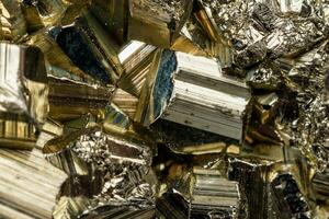 Macro mineral stone Pyrite on a black background photo