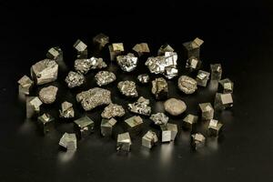 Macro mineral stone Pyrite on a black background photo