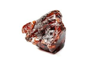 Macro mineral stone Garnet Spessartine on a white background photo