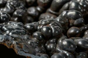 Macro mineral Hematite stone on a white background close-up photo