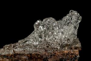 Macro Hyalite mineral stone on a black background photo