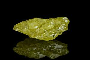 Macro mineral sulfur stone on a black background photo