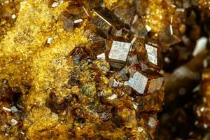 Macro mineral stone Garnet, Green Garnet, Epidote Grossular in the rock on a white background photo