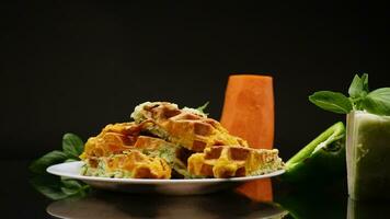 cooked twocolor vegetable waffles made from cabbage and carrots. video