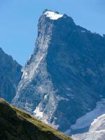 a mountain with snow on it photo