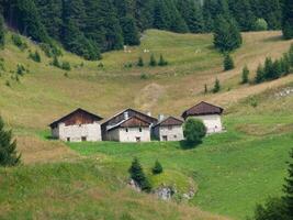 three stone houses in the mountains photo