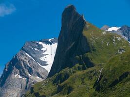 a mountain with snow on it photo