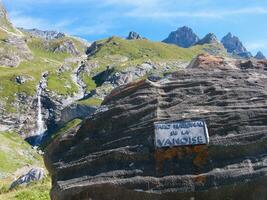 a mountain with a sign photo