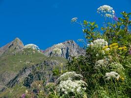 a mountain range with a blue sky photo