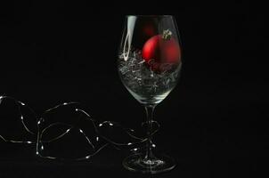 07.12.2023 St. Petersburg, a balloon with the inscription Coca Cola in a glass on a dark background photo