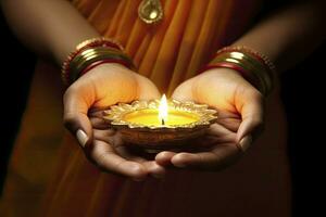 AI generated Beautiful hands holding Diwali lamps traditionally. AI Generated. photo