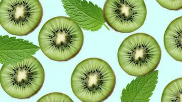 AI generated Slices of kiwi fruit and green mint leaves on a light pastel blue background. AI Generated photo