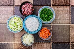 Various side dishes and small ingredients cut in the kitchen photo