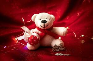 Gift and bear christmas dall decoration red color tone. photo
