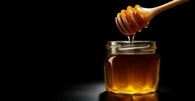 AI Generated Honey dipper and pouring honey with glass jar on black background photo