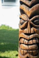 Wooden Tiki statue photo