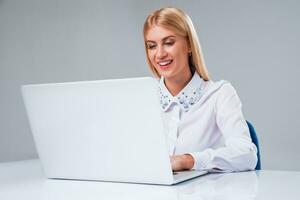 Young businesswoman working at laptop computer photo