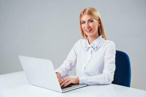 Young businesswoman working at laptop computer photo