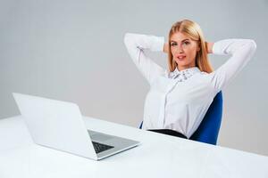 Young businesswoman working at laptop computer photo