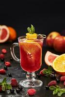 Fruit and berry tea with raspberry, currant, orange, grapefruit photo