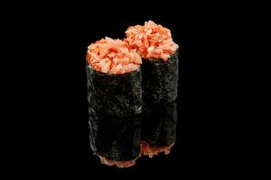 Gunkan maki sushi with tiger prawn on black background photo