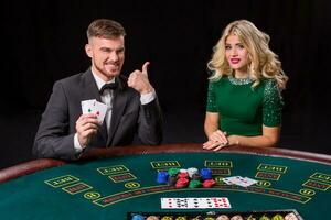 couple playing poker at the table. photo