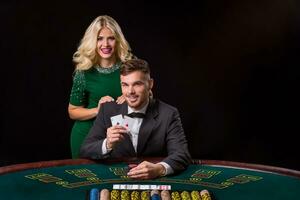 couple playing poker at the table. photo