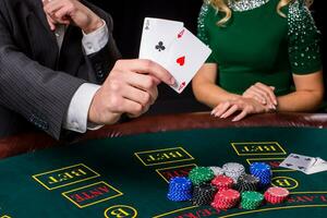 couple playing poker at the table. photo