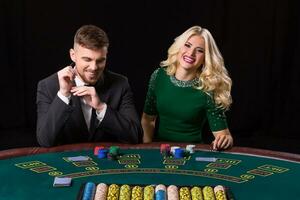 couple playing poker at the table photo