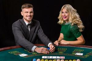 couple playing poker at the table. photo