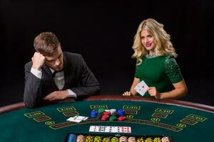 couple playing poker at the table. photo