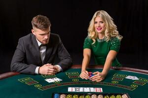 couple playing poker at the table. photo