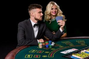 couple playing poker at the table. photo