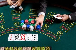 couple playing poker at the table photo