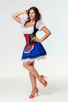 Beautiful young brunette girl of oktoberfest stein photo