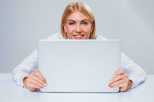 Young businesswoman working at laptop computer. photo