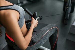 Photo of woman doing exercises on the simulator