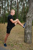 young athlete running in the forest photo