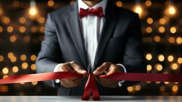 AI generated Man in tuxedo hands cutting red ribbon close-up, new project, opening ceremony. photo