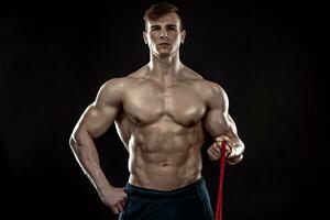 Young athletic man exercising photo