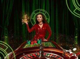 Golden coins falling down on palm of female in red dress who posing near roulette with stacks of chips. Background with green curtains. Poker, casino photo